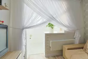 Отделка П-образного балкона искусственным камнем с утеплением