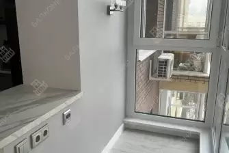 Дизайн-проект отделки лоджии под ключ с объединением кухни и панорамным остеклением